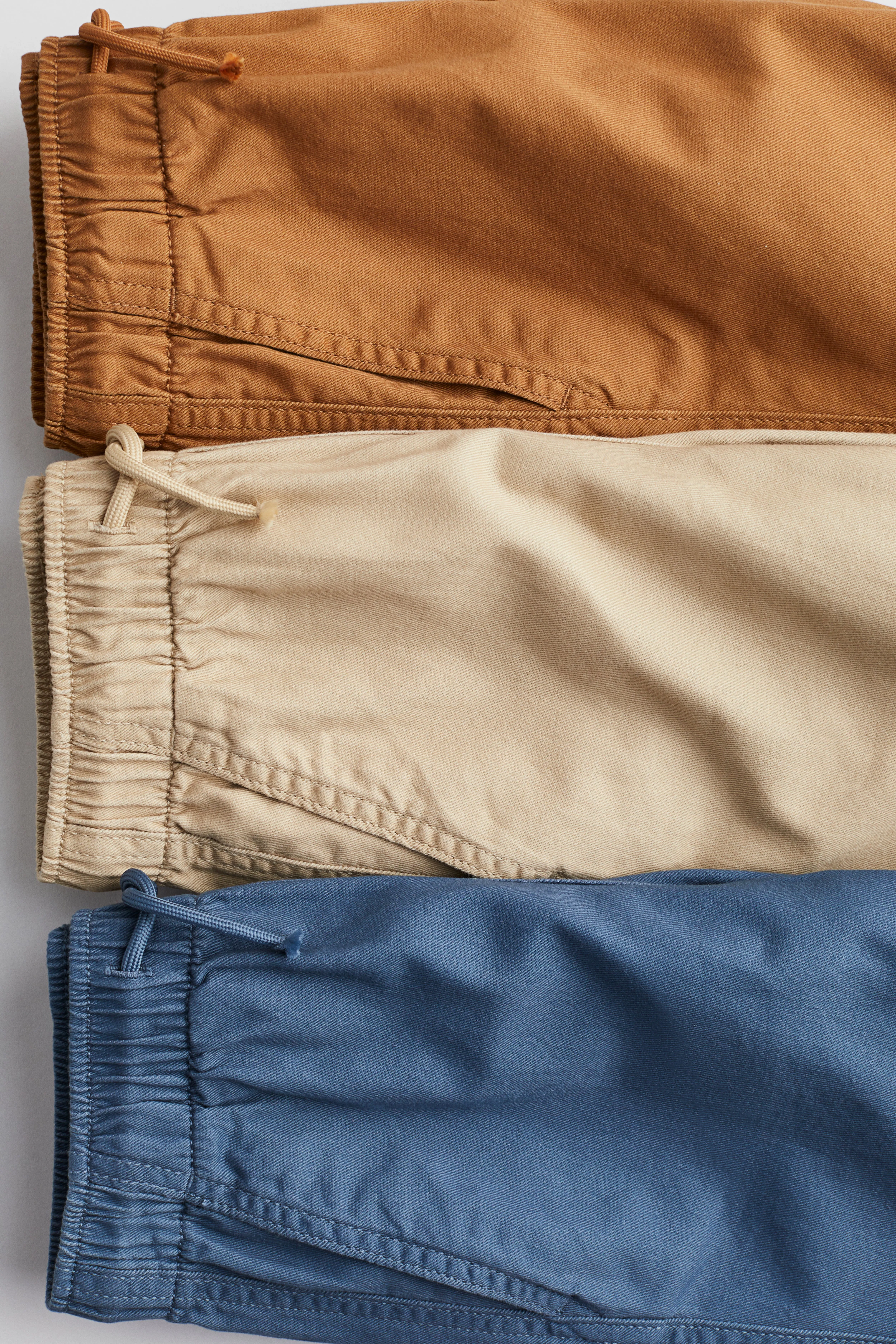 3-pack cotton joggers - Regular waist - Long - Blue/Light beige/Brown - Kids | H&M GB