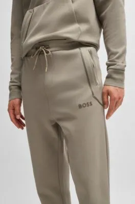 Cotton-blend tracksuit bottoms with mirror-effect logo