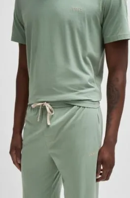 Cuffed tracksuit bottoms in stretch cotton with embroidered logo