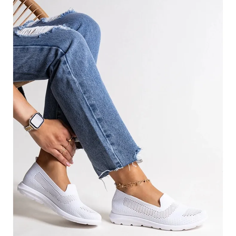 Rahim's white sneakers with a foam sole