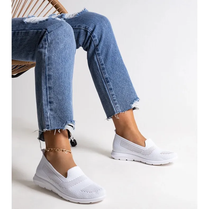 Rahim's white sneakers with a foam sole