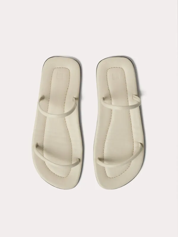 Toteme The City Slide Sandals | Luxury and style at your fingertips
