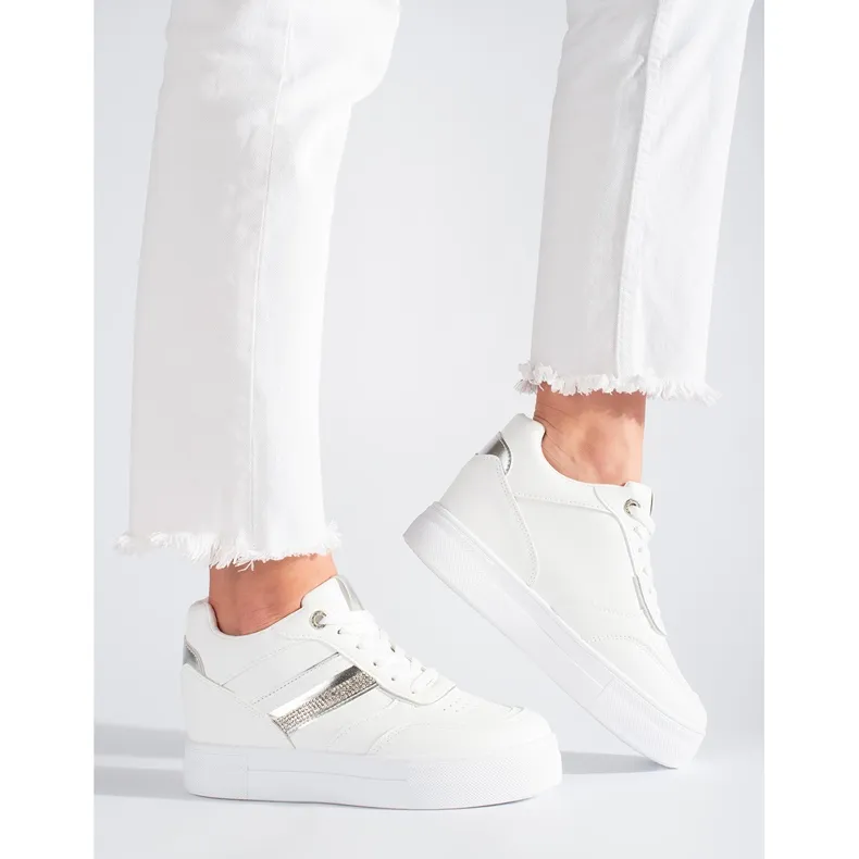 White sneakers with a hidden wedge